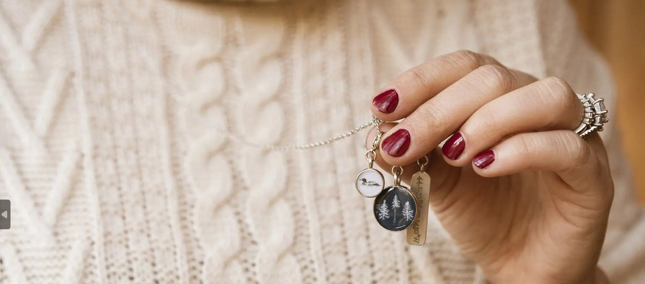 inspired by the lakes of Maine. The Woods Maine Three Pines Loon Charm Necklace . Made in Portland , Maine