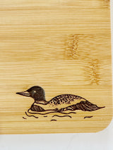 BUNDLE: The Woods Maine® Loon Cutting Board and Bamboo Coasters by Snowdon Customs